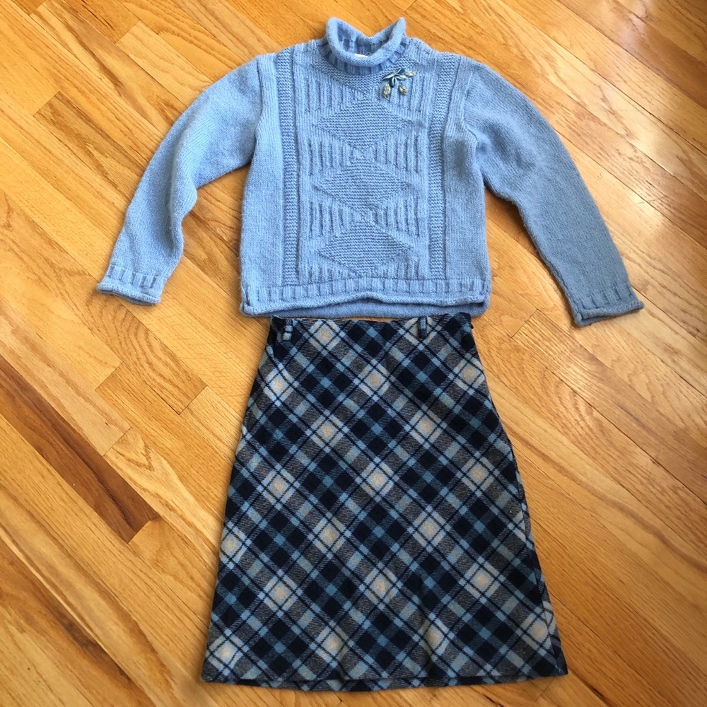 Blue turtleneck sweater with matching plaid skirt